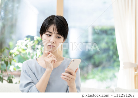 Young woman using a smartphone 131251262