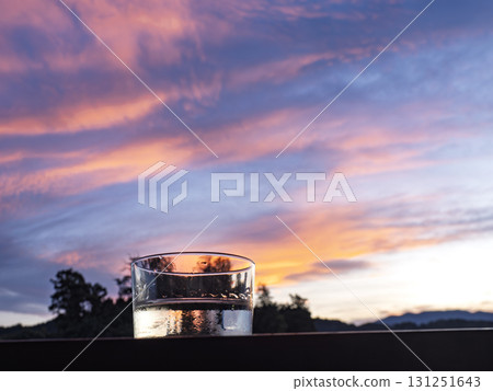 The brilliance of Junmai sake reflects the crimson sky The brilliance of Junmai sake reflects the crimson sky 131251643