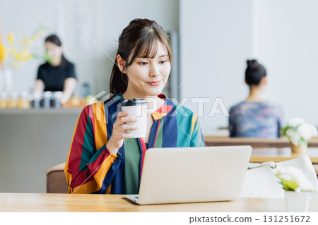 A young woman working in a cafe 131251672