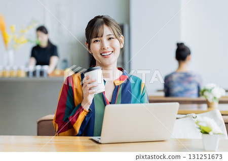 A young woman working in a cafe 131251673