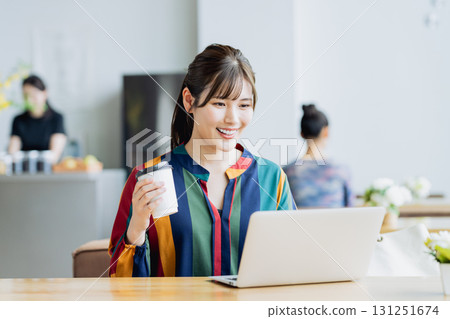 A young woman working in a cafe 131251674