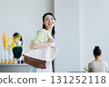A young woman visiting a cafe 131252118