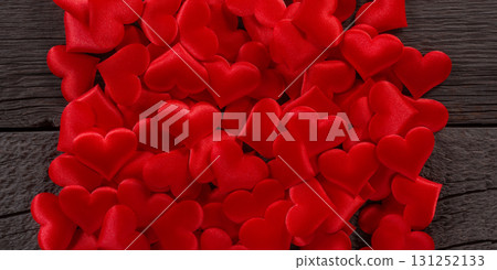 Bright Red Fabric Hearts Against Wooden Background Representing Love and Romance 131252133