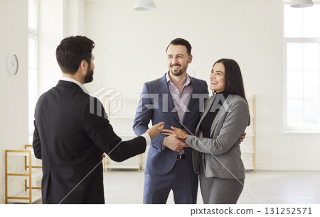 Family Couple Viewing New Home With Realtor Family Couple Viewing New Home With Realtor 131252571