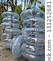 Stack of inflatable pool tubes ready for summer fun at a tropical resort 131252681