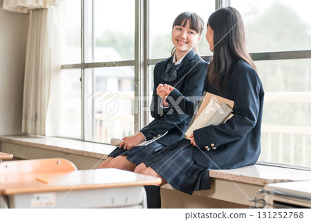 Two friendly junior high school girls in uniforms making a pinky promise (promise, exam, career path) 131252768