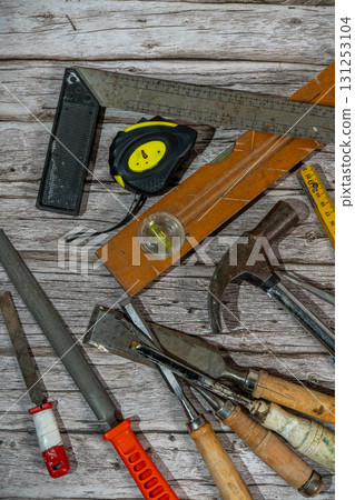 Carpenter tools lying on wooden table in workshop Carpenter tools lying on wooden table in workshop 131253104