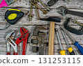Handyman tools laying on rustic wooden background for home improvement projects 131253115