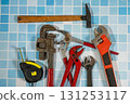 Plumbing tools lying on blue tiles getting ready for work 131253117