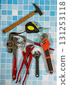 Plumbing tools lying on blue tiles getting ready for work 131253118