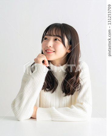 Young woman resting on elbows 131253709