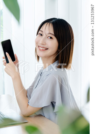 A young lady with a smartphone A young lady with a smartphone 131253967