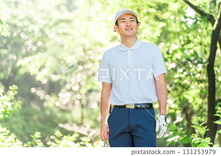 Male golfer wearing golf wear among fresh greenery (golf course, academy, membership) Male golfer wearing golf wear among fresh greenery (golf course, academy, membership) 131253979