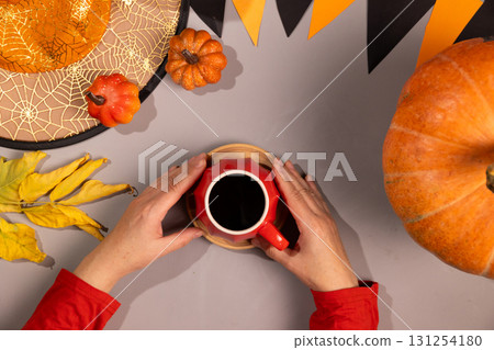 Enjoying Coffee During Halloween Thanksgiving Season Enjoying Coffee During Halloween Thanksgiving Season 131254180