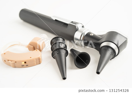 Otoscope isolated on white background for otolaryngologist or ENT physician doctor examining senior patient ear, hearing loss problem. 131254326
