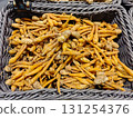 Fresh Organic Turmeric Roots in a Market Basket Display 131254376