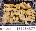 Fresh Organic Ginger Roots in a Woven Basket for Culinary Use 131254377