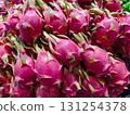 Vibrant Pink Dragon Fruits Stacked in a Fresh Market Display 131254378