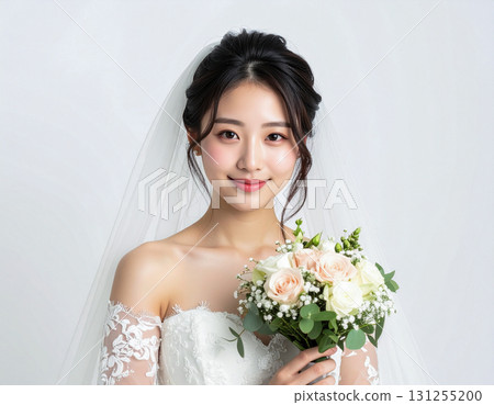 A young woman in a dress holding a bouquet 131255200