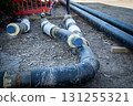 Underground Pre-Insulated Heating Pipes on Construction Site 131255321