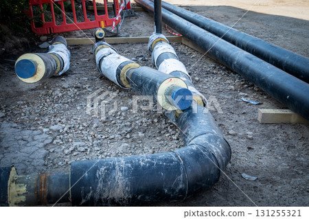 Underground Pre-Insulated Heating Pipes on Construction Site 131255321