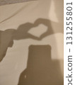 Shadow of a child's hands making a heart shape 131255801