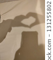 Shadow of a child's hands making a heart shape 131255802
