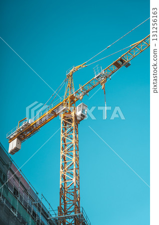 Crane on construction site background. Crane on construction site background. 131256163