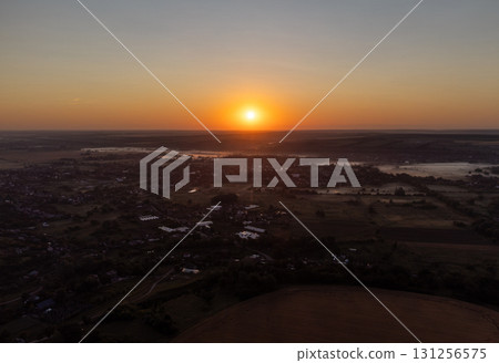 Golden Dawn Over Farmland and Fields 131256575