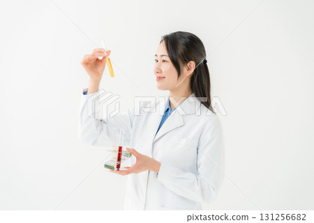 Business woman in white coat researcher 131256682