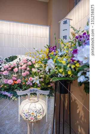 Flowers and lanterns from the grandchildren and an altar full of flowers displayed at the funeral hall Flowers and lanterns from the grandchildren and an altar full of flowers displayed at the funeral hall 131256875
