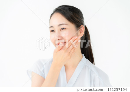 Woman touching her cheek beauty 131257194