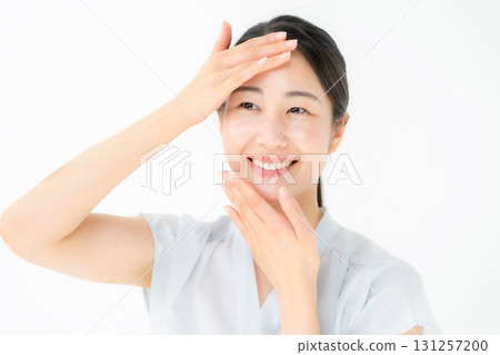 Woman touching her cheek beauty 131257200