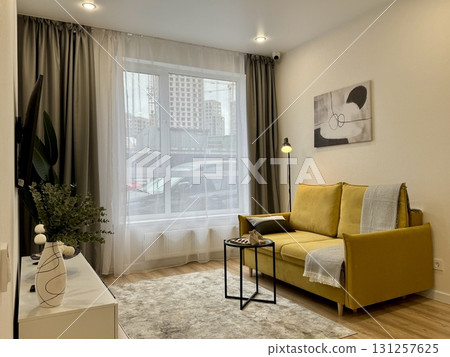 modern living room in a stylish interior of a new apartment with designer renovation modern living room in a stylish interior of a new apartment with designer renovation 131257625