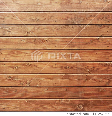 方形背景圖案，由紅棕色木板組成，木板上有紋理和節疤，用圓頭黃銅釘固定在一起 131257986