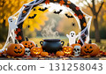 A frame consisting of a garland of Halloween elements: pumpkins, a black cauldron, skulls, cobwebs and spiders, bats, and cheerful ghosts 131258043