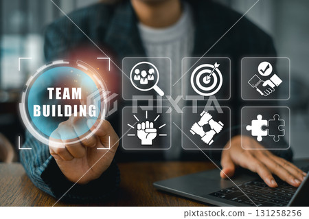 Engaging team building concept featuring digital icons symbolizing collaboration, unity, and teamwork in a modern workspace. 131258256