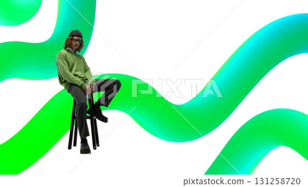 Modern collage. Man in green sweater and sunglasses sitting on stool with neon green digital waves Modern collage. Man in green sweater and sunglasses sitting on stool with neon green digital waves 131258720