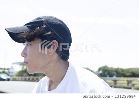 Child with earphones 131259684