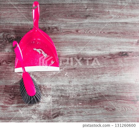 small whisk broom and dustpan on wooden floor small whisk broom and dustpan on wooden floor 131260600