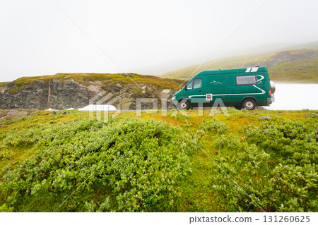 Camper car in norwegian mountains 131260625