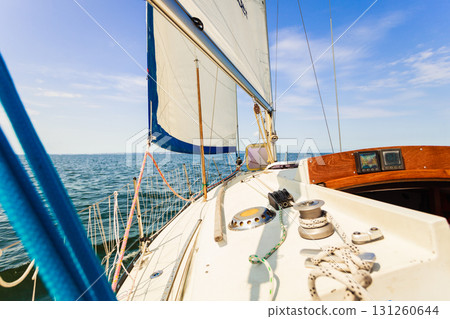 Yachting on sail boat during sunny weather Yachting on sail boat during sunny weather 131260644