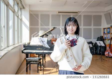 Female student with a trumpet 131260681