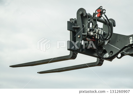 Forklift industrial loader or stacker against sky. Forklift industrial loader or stacker against sky. 131260907