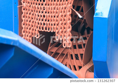 Rotating mechanism in industrial wood debarking machine on woodworking plant. 131262307