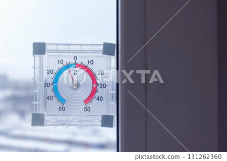 Thermometer on the window with negative temperature in winter. 131262360