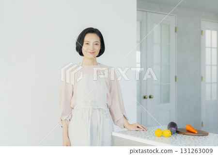 Woman pointing in the kitchen 131263009