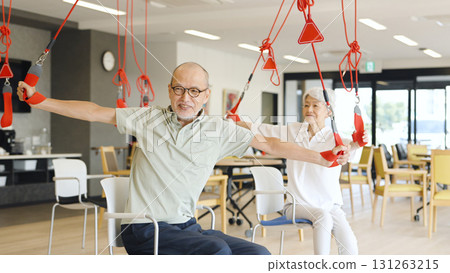 Elderly people receiving sling therapy at a nursing home Elderly people receiving sling therapy at a nursing home 131263215