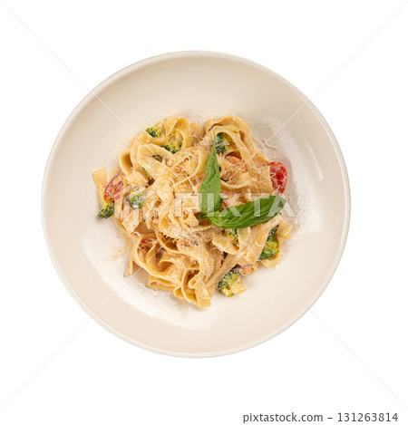 Isolated fettuccine pasta with broccoli and sauce Isolated fettuccine pasta with broccoli and sauce 131263814