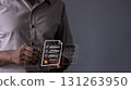 Young man with smartphone mobile hand using a pen touching to sign a Online Business Contract, 131263950
